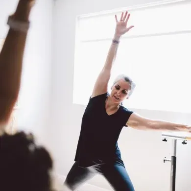 An Essentrics class flowing through full-body stretches at Momentum Pilates