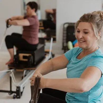 An instructor demonstrating reformer work in a Virtual Reformer 50+ class